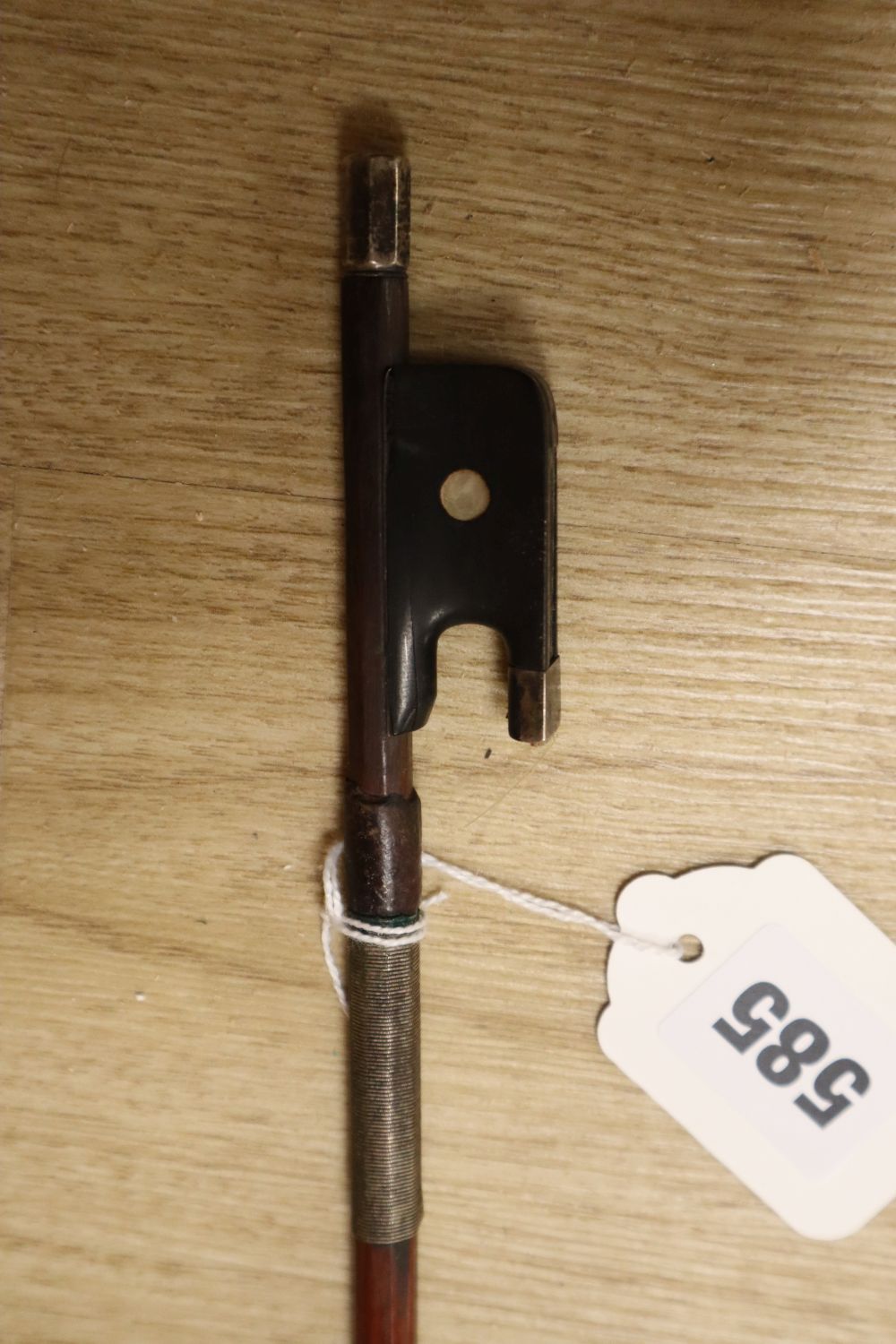 A silver-mounted violin bow, unsigned, 29in.